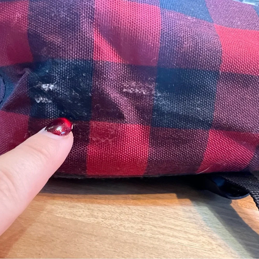 Herschel Supply Co. Pop Quiz backpack in a red and black buffalo plaid pattern.